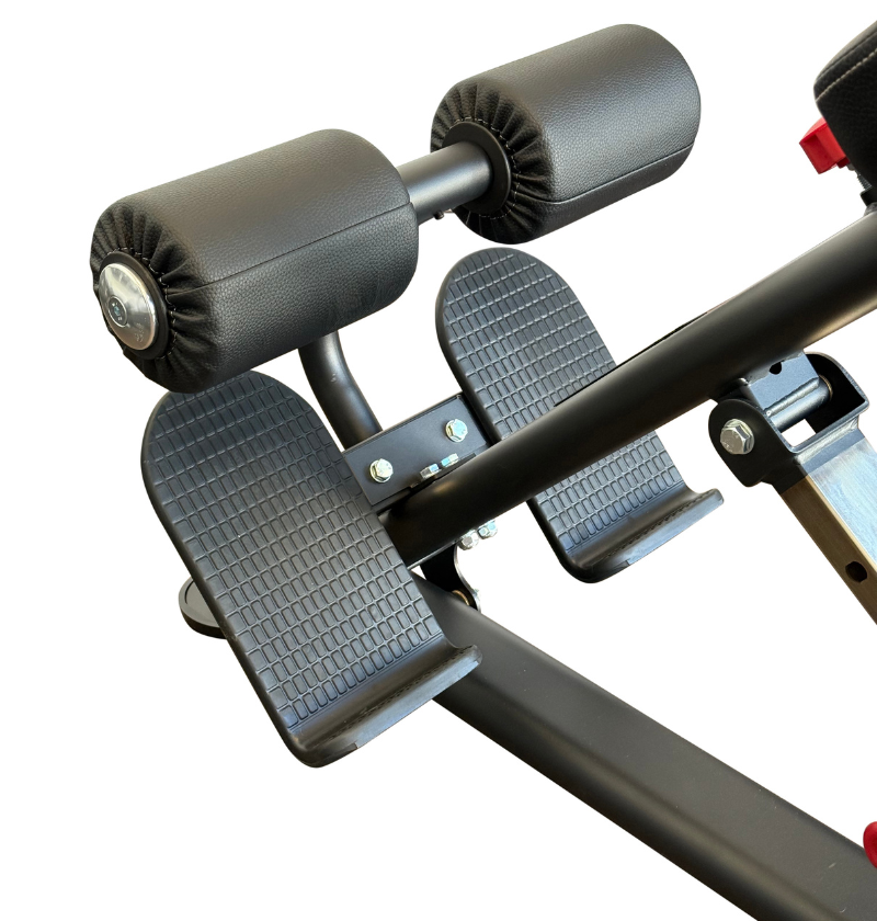 Hyperextension black workout equipment footplate and padded rollers close up