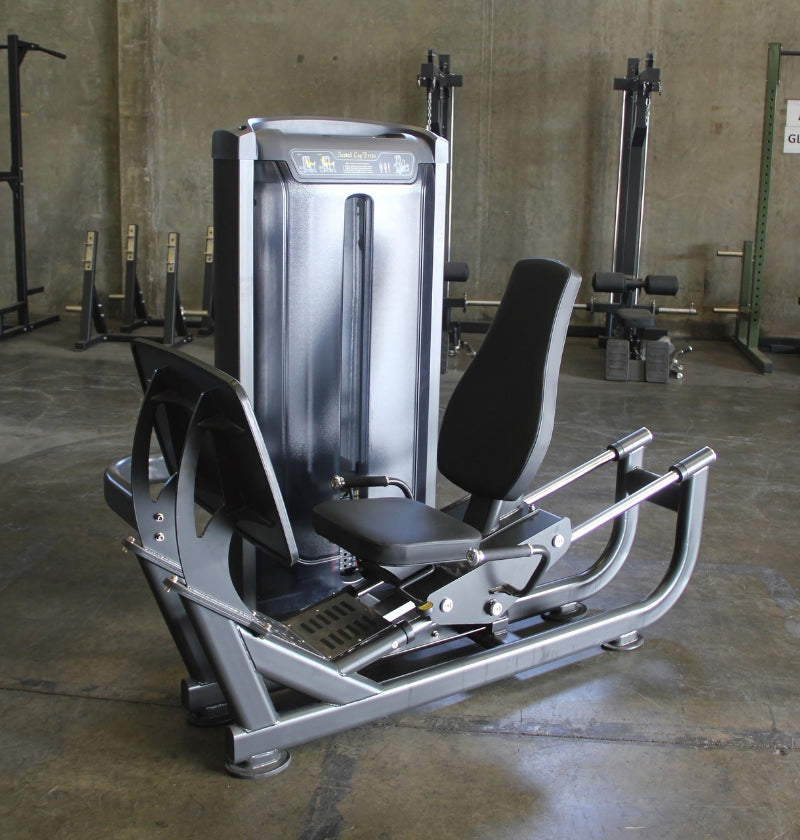 seated leg press machine in a warehouse