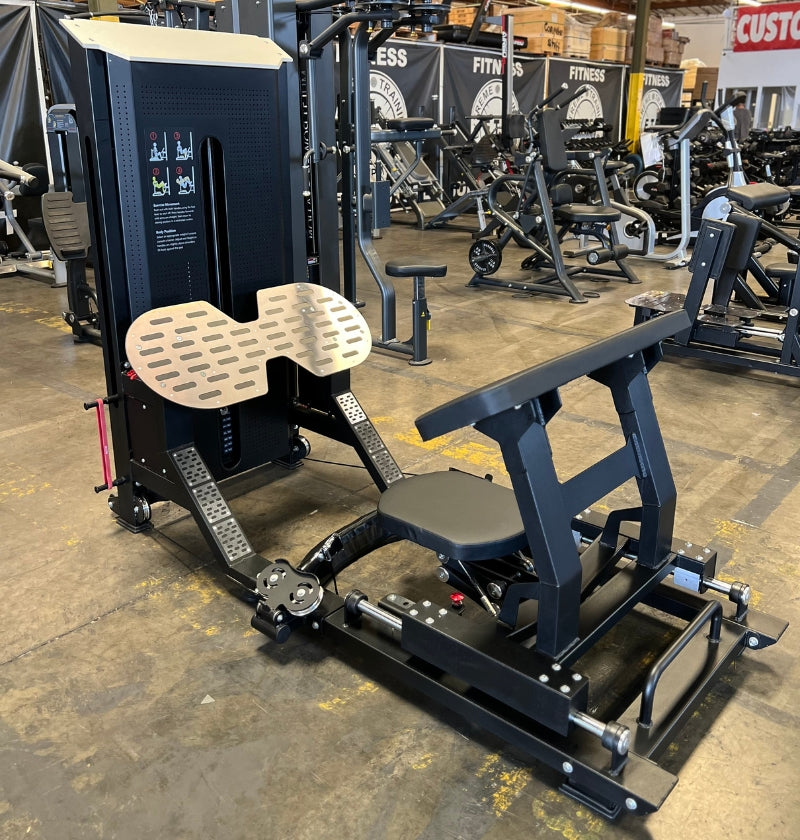 A selectorized hip thrust machine located in a gym, used for targeting glute muscles during workouts.