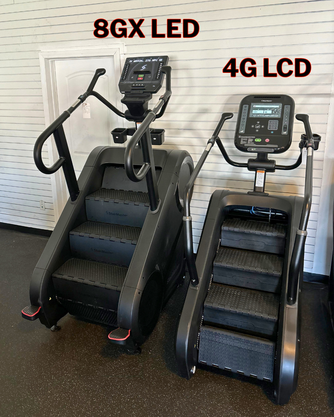Two stairclimbers with digital displays labeled '8GX LED' and '4G LCD' on a gray floor.