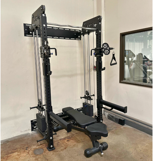Black wall mounted cable machine gym equipment in a warehouse.
