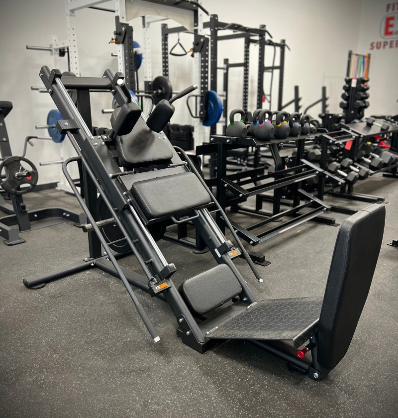 Black and white illustration of a Leg Press Hack Squat DR003, a machine for leg strength training