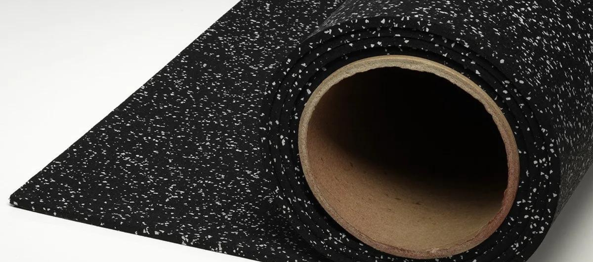 A roll of black rubber flooring with white speckles, available in 5/16" or 3/8" thickness.