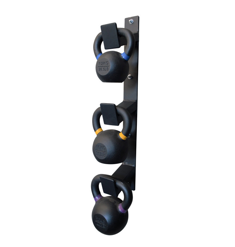 Wall-mounted kettlebell rack with three different colored kettlebells arranged neatly.