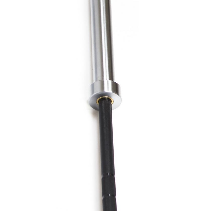 Close-up of a metal Olympic bar with a black handle, designed for weightlifting and strength training.