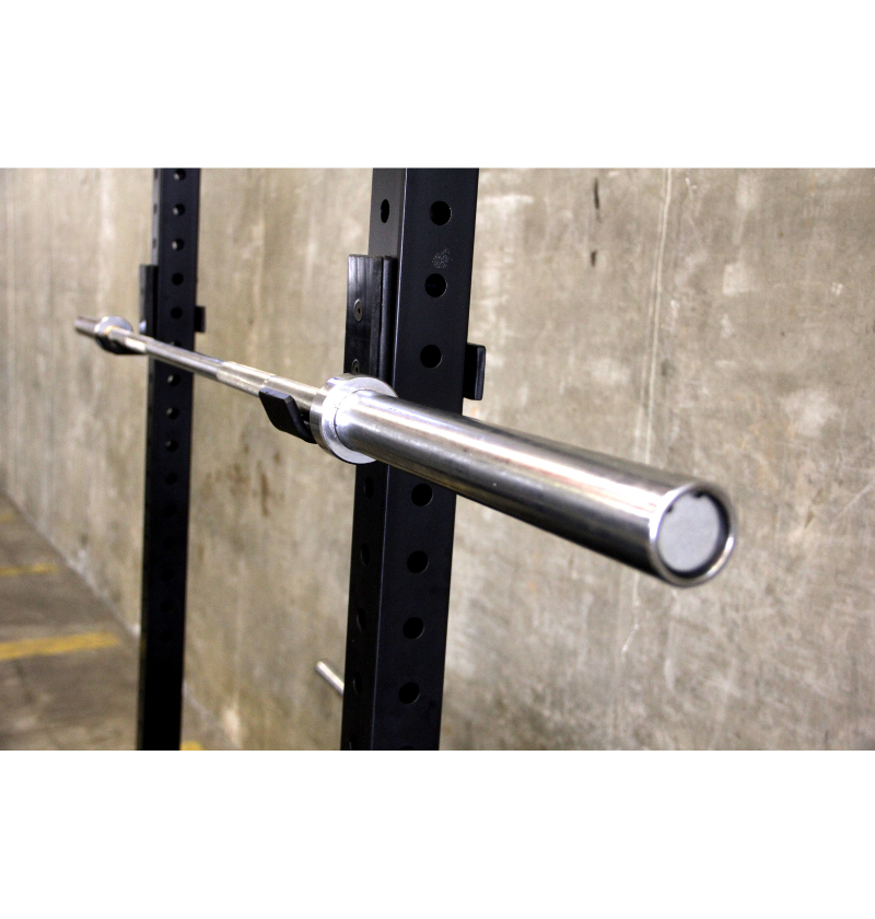 A Men's Olympic barbell securely mounted to a wall, ready for weightlifting exercises.