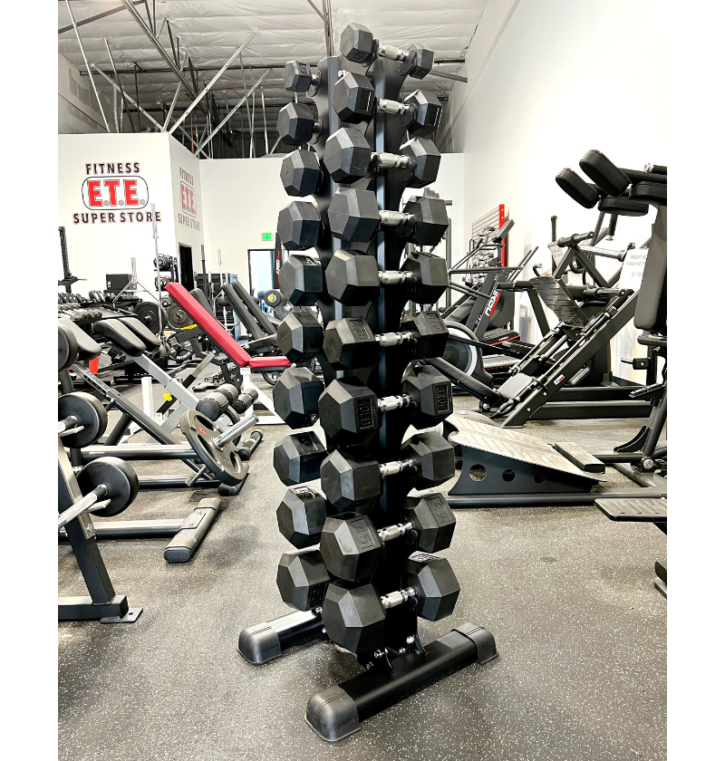 A gym equipment rack displaying various weights and dumbbells organized for easy access.