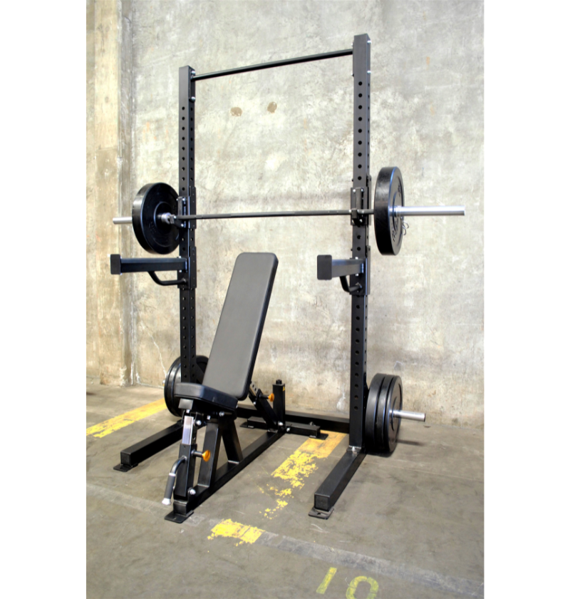 A black power rack is displayed, showcasing its sturdy frame and design for strength training exercises.