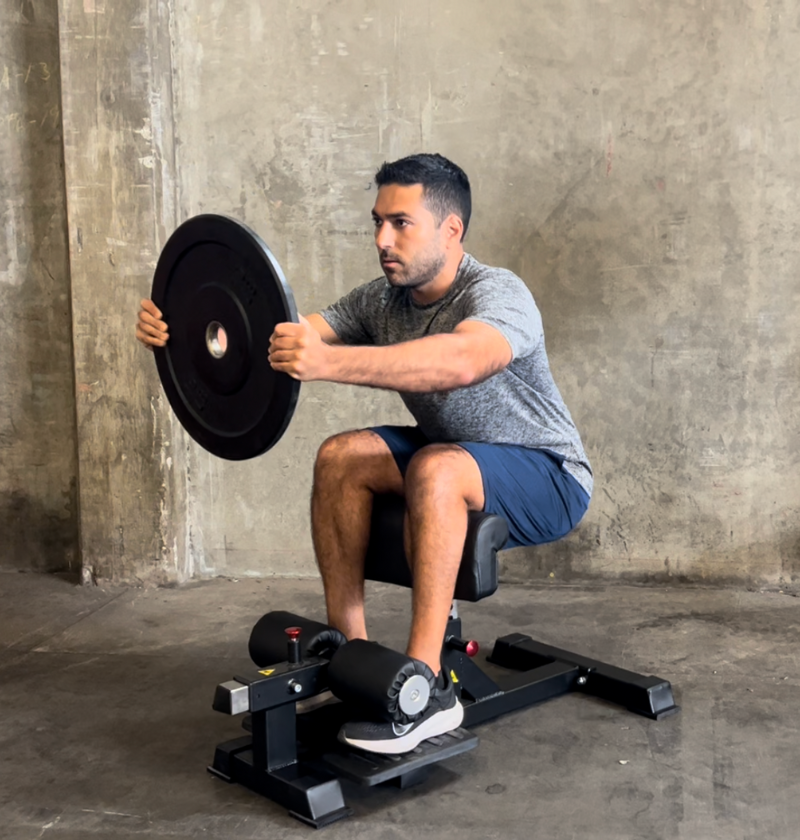 person using sissy squat machine