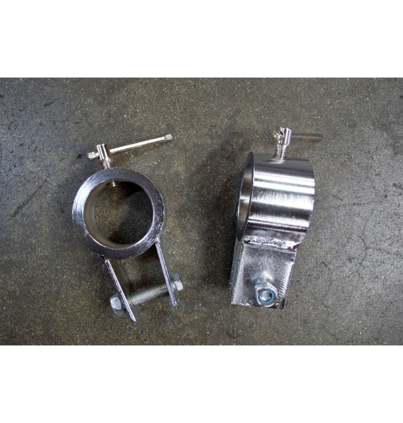 Two silver chrome weightlifting chain collars on a textured gray surface.