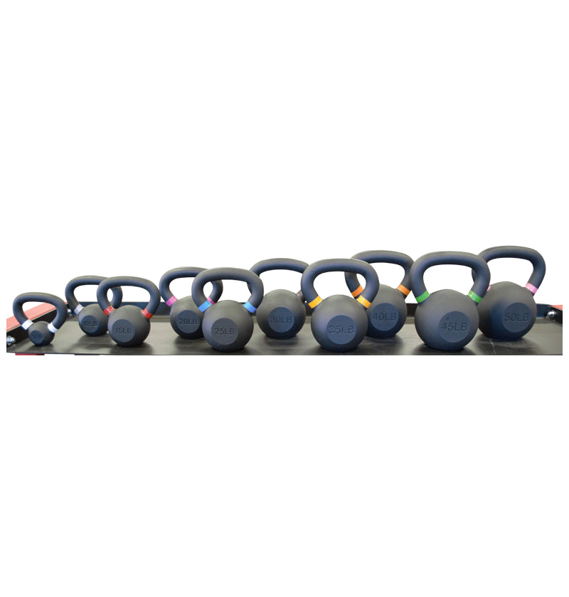 A set of kettlebells, weights from 5 to 50 lbs, arranged neatly against a white backdrop.