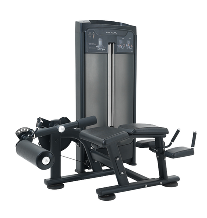 Black prone leg curl machine on a white background.