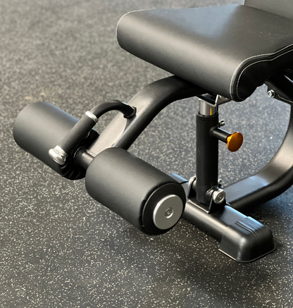 A black exercise bench equipped with a footrest, ideal for supporting various workout positions and exercises.