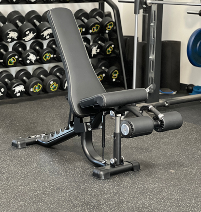 Gym bench in a fitness center with weights in the background