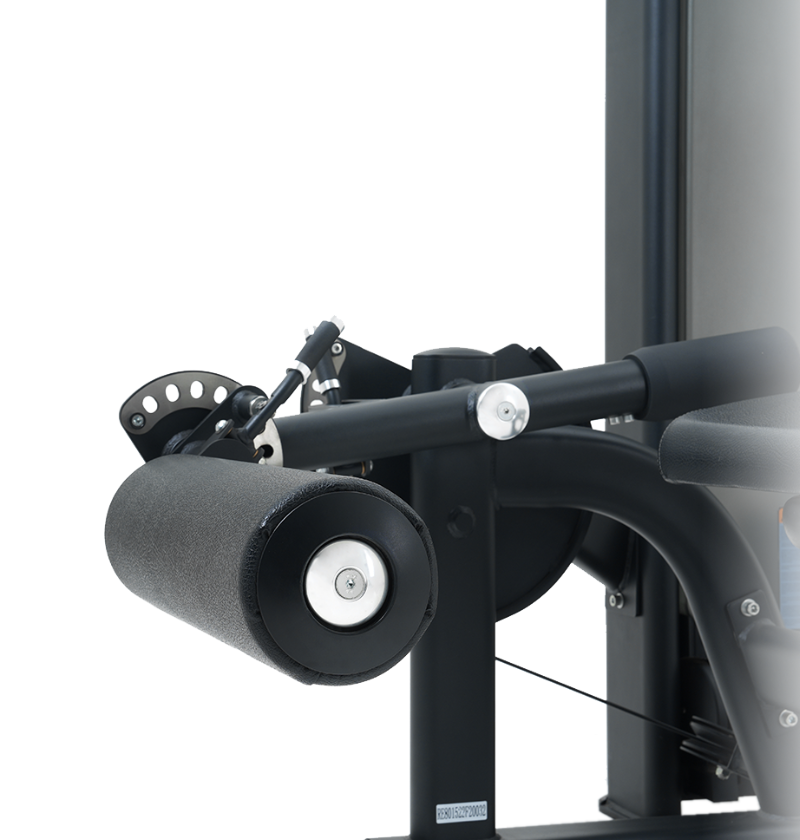 Close-up of a black prone leg curl machine on a white background.