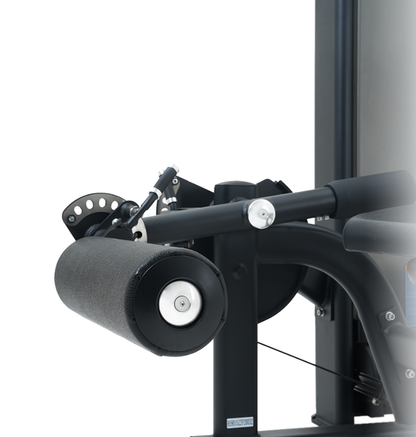Close-up of a black prone leg curl machine on a white background.
