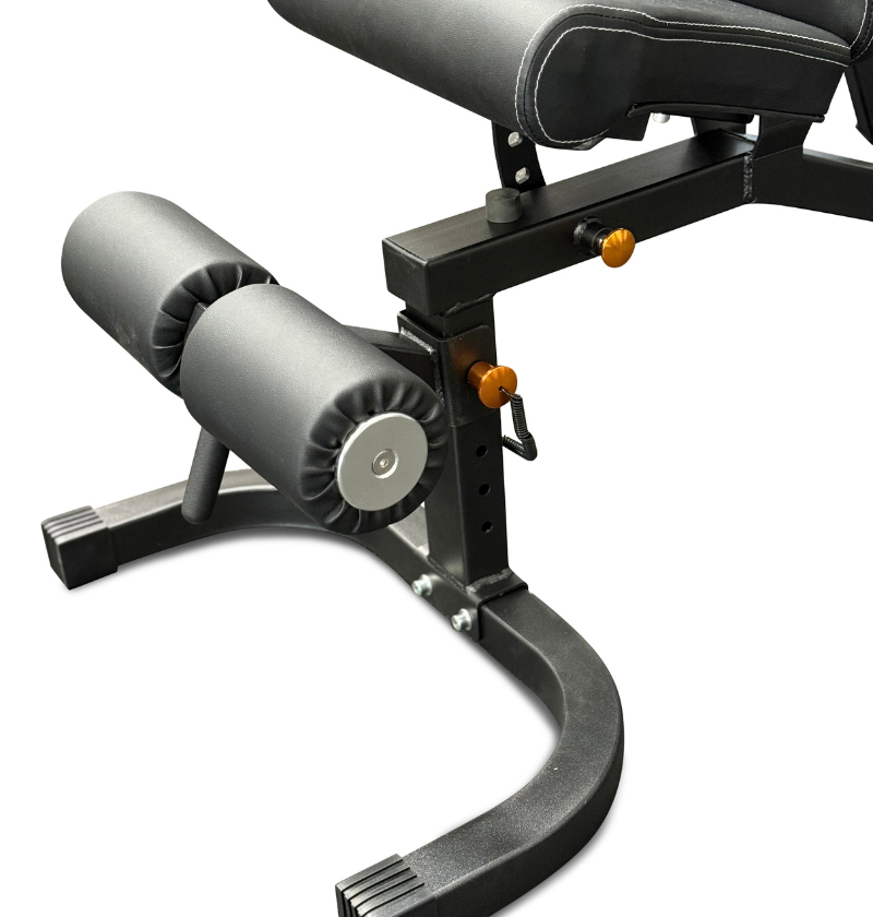 Grey adjustable bench with foot support pads on a white background. 