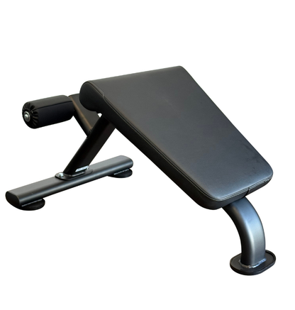 Black ab bench with padded backrest and angled incline platform, photographed on a plain white background.