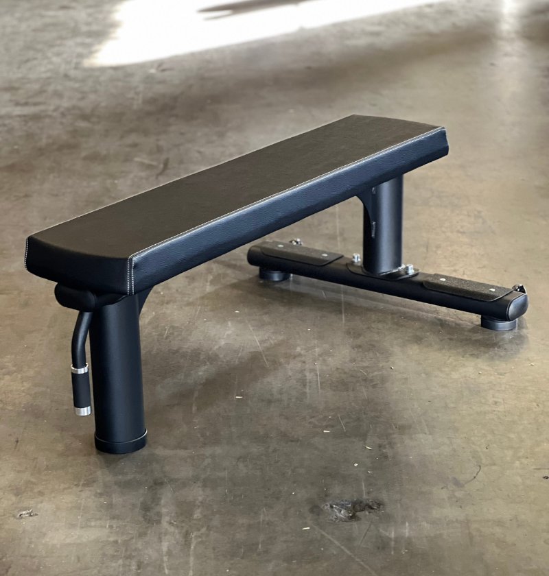 black flat bench on a warehouse floor