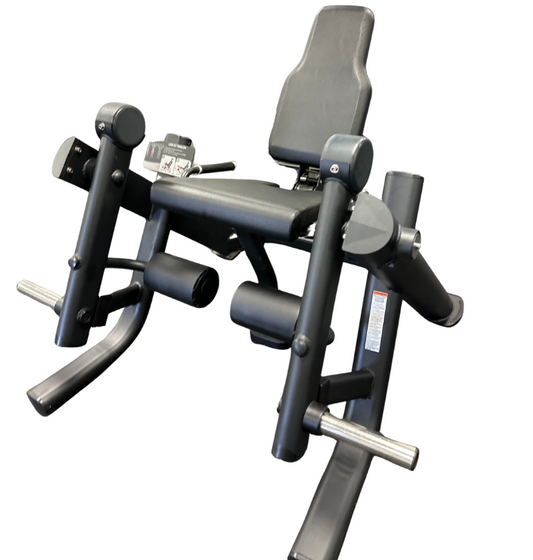 Black seated plate loaded leg extension machine on a white background.