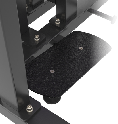 Black foot plate on a standing hip thrust machine on a white background