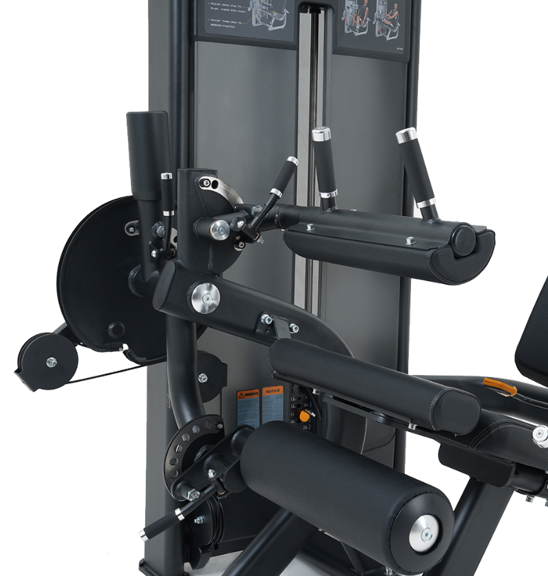 Close-up of a black leg extension leg curl machine on a white background
