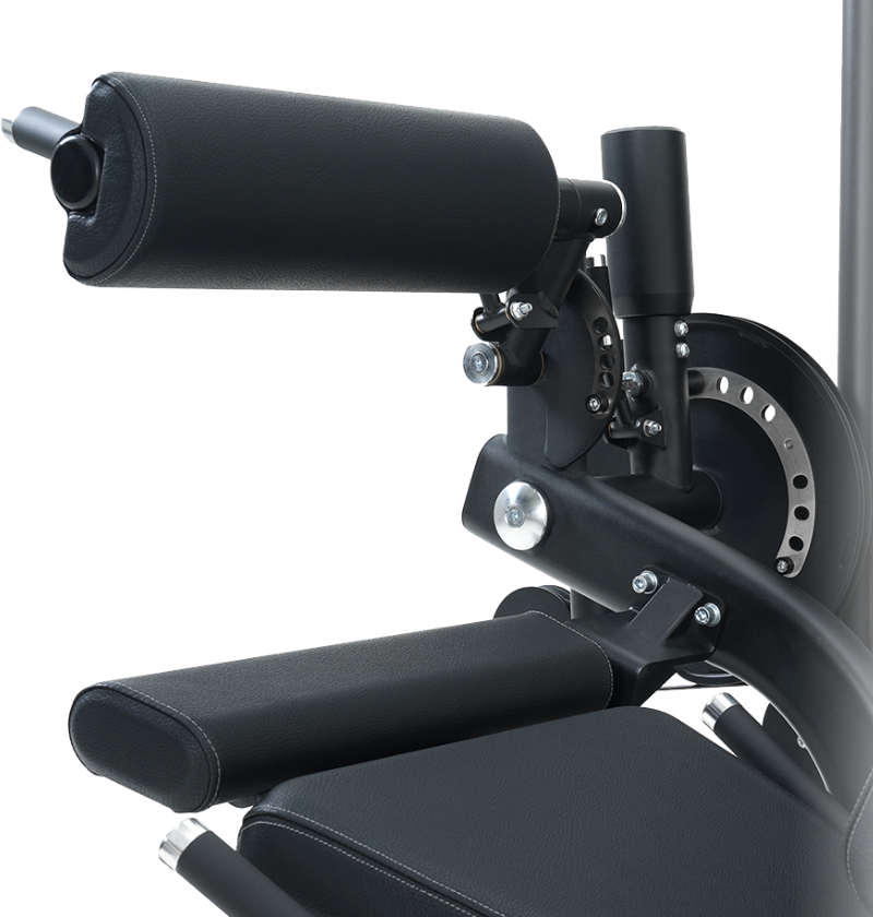 Close-up of the black pads on the seated leg extension leg curl machine on a white background