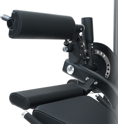 Close-up of the black pads on the seated leg extension leg curl machine on a white background