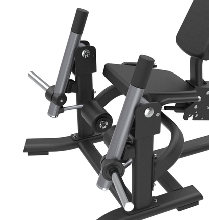 Close-up of a black plate loaded leg extension machine on a white background