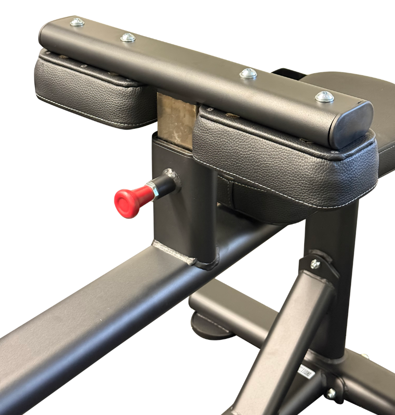 Close-up of a seated calf with black padded armrests and a red adjustment knob on a white background.