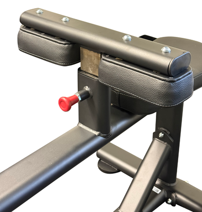 Close-up of a seated calf with black padded armrests and a red adjustment knob on a white background.
