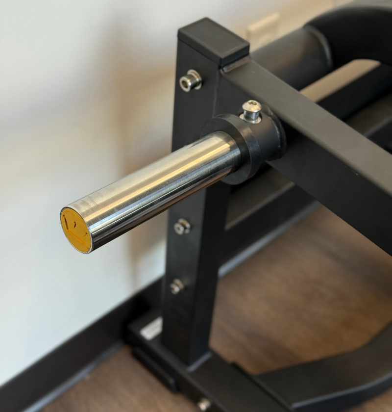 Close-up of a weight storage peg on the front squat in the showroom.