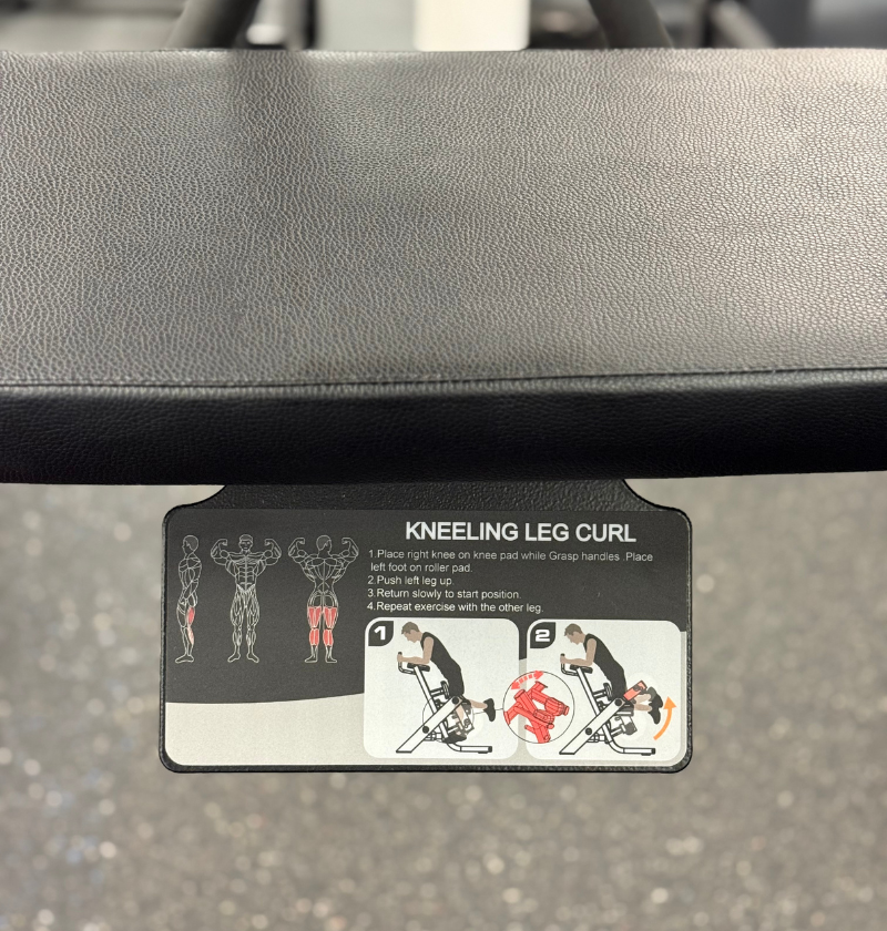 Instructions for a kneeling leg curl exercise on a gym machine.