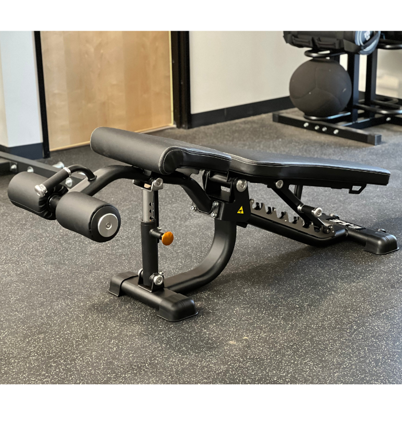 A black exercise bench equipped with a footrest, ideal for supporting various workout positions and exercises.