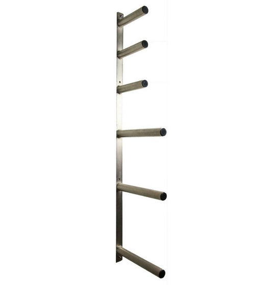 A wall mounted Olympic plate rack with multiple pegs for storing weight plates.
