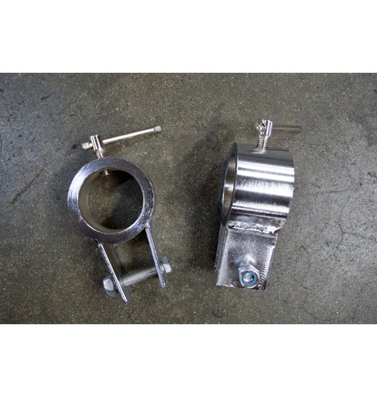 Two silver chrome weightlifting chain collars on a textured gray surface.